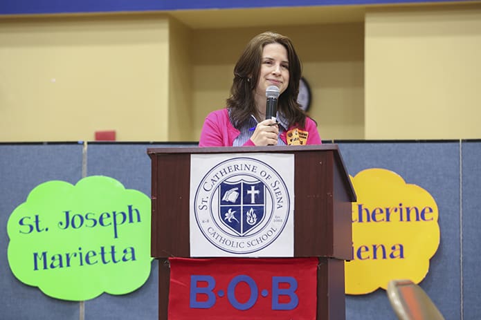 Angela Williams, a librarian at Marist School, Atlanta, served as the mistress of ceremonies in the morning and she posed questions to the teams during the final competitions in the afternoon. Photo By Michael Alexander