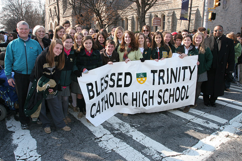 Deacon Chris Thompson of Our Lady of the Assumption Church, Atlanta, back row far left, Karen Hurley, director of student activities for Blessed Trinity High School, back row second from left, and Father Ricardo Bailey, Blessed Trinity chaplain, back row far right, join students from the Roswell school at the annual memorial service and march for the unborn. Photo By Michael Alexander