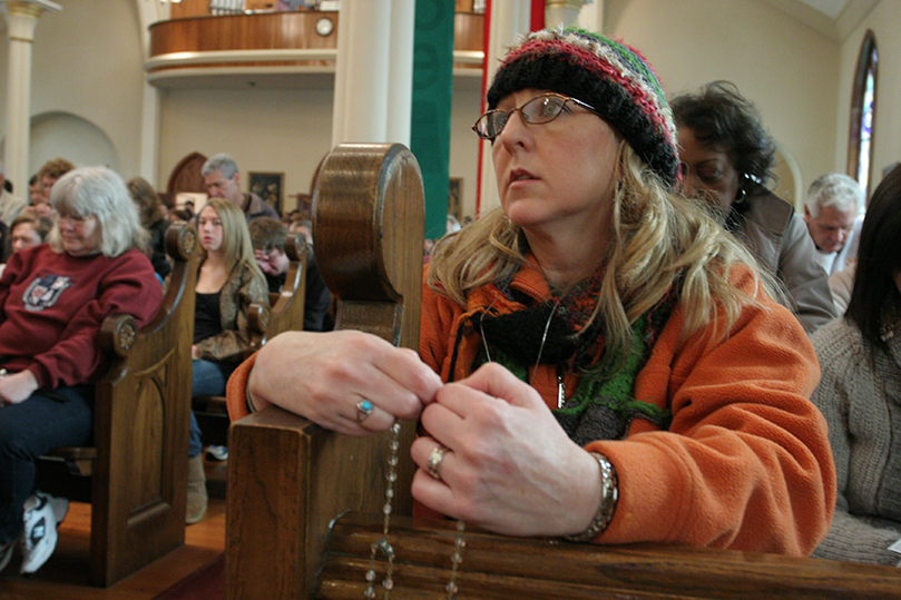 Salena Troy of St. Pius X Church, Conyers, joins others at the Shrine of the Immaculate Conception, Atlanta, in reciting the rosary prior to the Mass For The Unborn. Photo By Michael Alexander