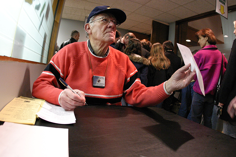 Al Garofalo fills take-out orders at a table in the hallway. Photo By Michael Alexander