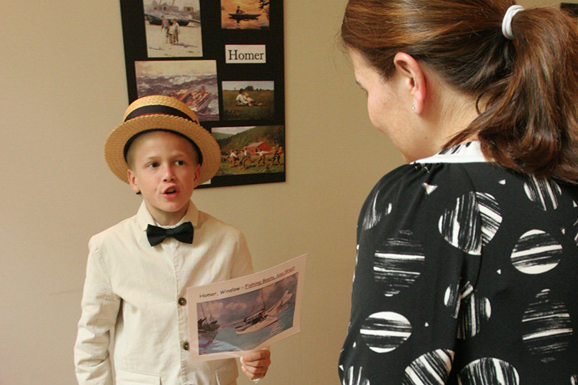 Standing before St. Jude parent Casey Reynolds, right, Tres Gonzalez comes to life as American landscape painter Winslow Homer. Photo By Michael Alexander