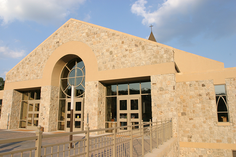 With its natural granite facing, the new St. John Neumann Church, Lilburn, is some 36,000 square feet when you figure in the space for the upper and lower lever. The Gwinnett County church seats nearly 900 people. Photo By Michael Alexander