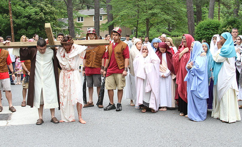 Assisted in carrying the cross by Simon of Cyrene, Jesus meets the women of Jerusalem along his walk to Calvary. Photo By Michael Alexander