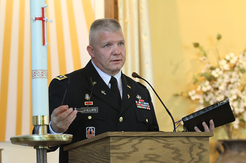 Lt. Col. Robert E. Phillips, garrison chaplain, correlates the closing of the chapel and the dispersing of its congregants to the words from Genesis 12:1-9 (Abram Journeys to Egypt). Photo By Michael Alexander