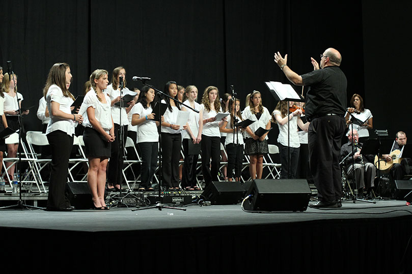 Queen of Angels School, Roswell provides the liturgical music during the Vigil Mass, June 25. The choir is under the direction of Deacon Dave Thomasberger, the school's music instructor. Photo By Michael Alexander