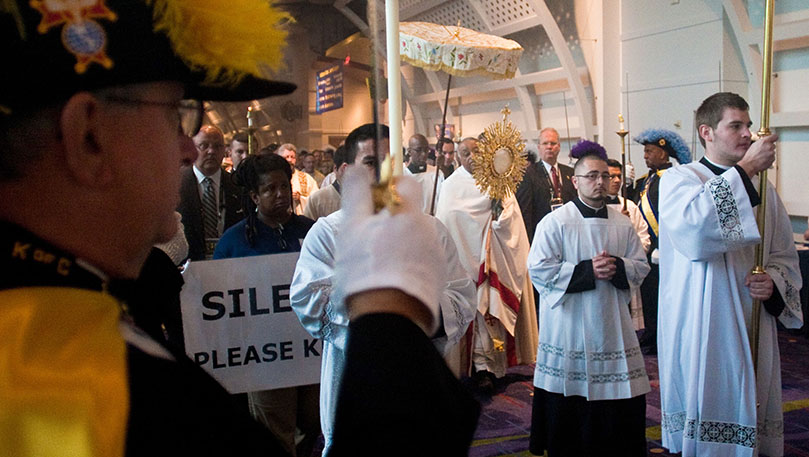 As the 16th annual Eucharistic Congress begins, the Knights of Columbus honor guard lines the hallway to make way for the eucharistic procession. Photo by Thomas Spink