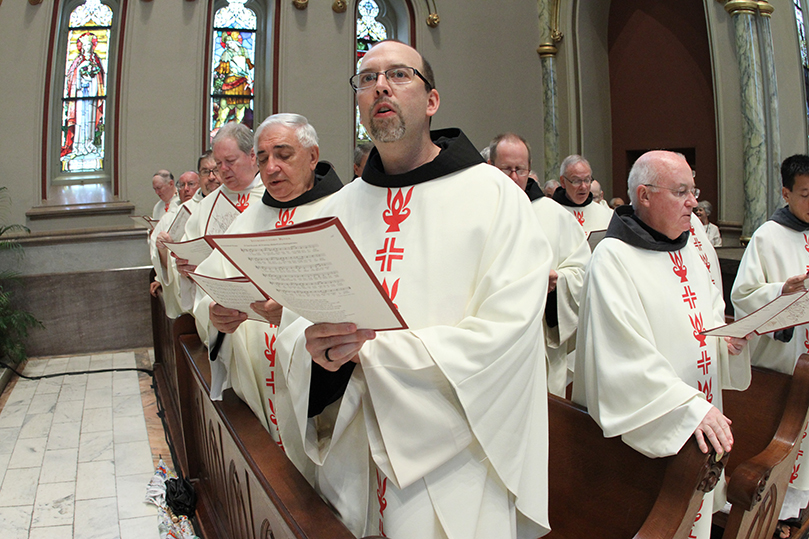 Conventual Friar Father Michael Lasky, center, and his fellow friars attend the episcopal ordination of Bishop-elect Gregory John Hartmayer, who is also a Conventual Friar. Lasky travelled from New York City, where he serves as director of the Americas for Franciscans International at the United Nations. Photo By Michael Alexander