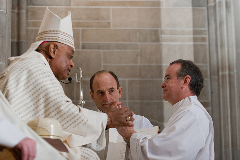 St. Thomas the Apostle Church diaconate candidate Mark Mitchell pledges his obedience to Archbishop Wilton D. Gregory and his successors. Photo By Thomas Spink/Archdiocese of Atlanta