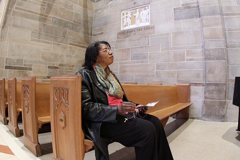 Christ the King parishioner Deborah Gibbs recites the sorrowful mysteries of the rosary just after 9 a.m. on a Friday morning. A group of parishioners usually say the rosary after the 6:45 a.m. Mass on Fridays when there's a school Mass.