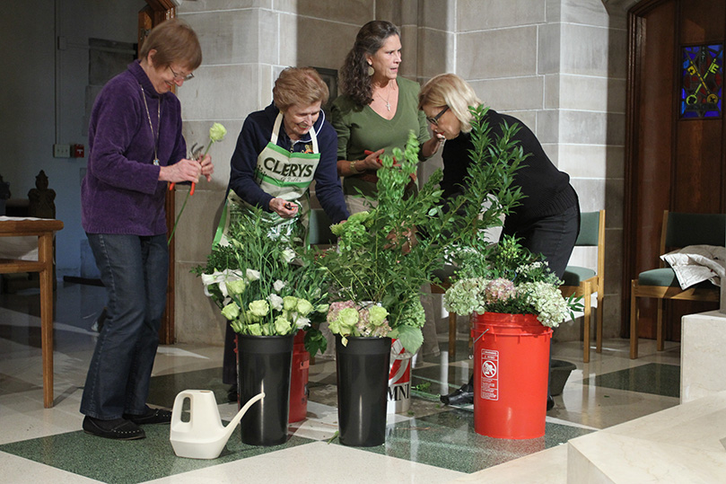 Flower Guild members (l-r) Jane Murray, Norine McCahey, Lawrie Peyton and Linda Seitz work on the flowers for an upcoming weekend of Masses. Seitz and Murray are the co-chairs of the Flower Guild, which was formed in August 2008. Today it has some 30 members.