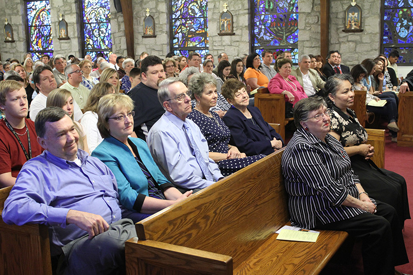 The congregation of Our Lady of Perpetual Help Church, Carrollton, listens to Archbishop Wilton D. Gregory during a Mass on the Feast of the Annunciation of the Lord, March 26. Archbishop Gregory served as the main celebrant and homilist for the liturgy marking the 50th anniversary of its existing church. Photo By Michael Alexander