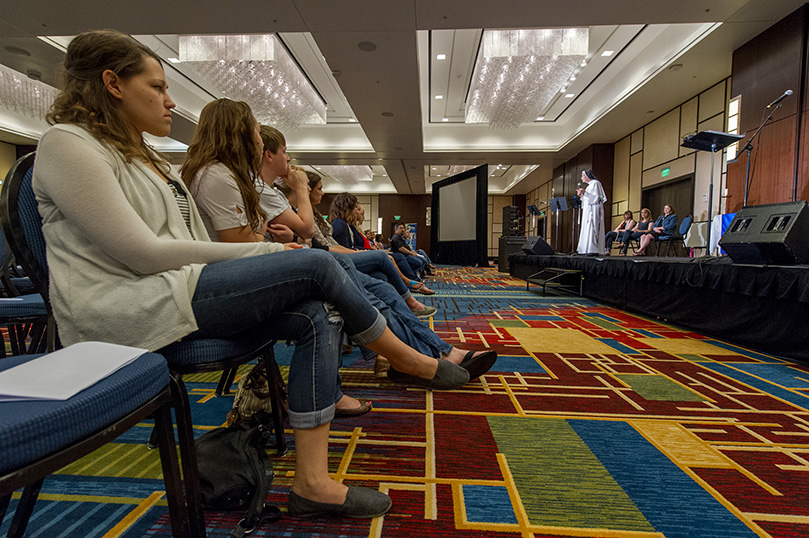 The audience of young adults listen as Mother M. Assumpta Long speaks to them. Photo by Stanley Leary