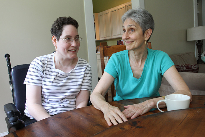 Lara's mom Sigrid Swenson, right, discusses the benefits of her daughter living at the L'Arche Atlanta home in Decatur. Photo By Michael Alexander