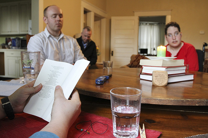 After the evening meal, the group moves into prayer time. There is usually a reading from Scripture and an opportunity for house residents to share what is on their hearts. Photo By Michael Alexander