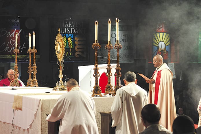 Archbishop Wilton D. Gregory leads adoration, exposition and Benediction of the Blessed Sacrament during the second day of the 18th annual Eucharistic Congress. Photo by Michael Alexander