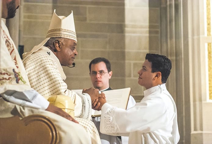 Rey Pineda pledges his obedience and respect to Archbishop Gregory and his successors. (Photos by Thomas Spink/Archdiocese of Atlanta)