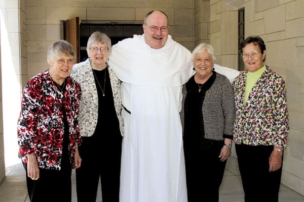 Dominican Father Bruce Schultz, parochial vicar at Our Lady of Lourdes Church, Atlanta, and a 2013 silver jubilarian, poses with Dominican Sisters (l-r) Marie Sullivan, Patricia Caraher, Nora Ryan, and Emeric Bouch. The sisters attended the May 15 Jubilarian Mass to support their brother Dominican. Photo by Michael Alexander