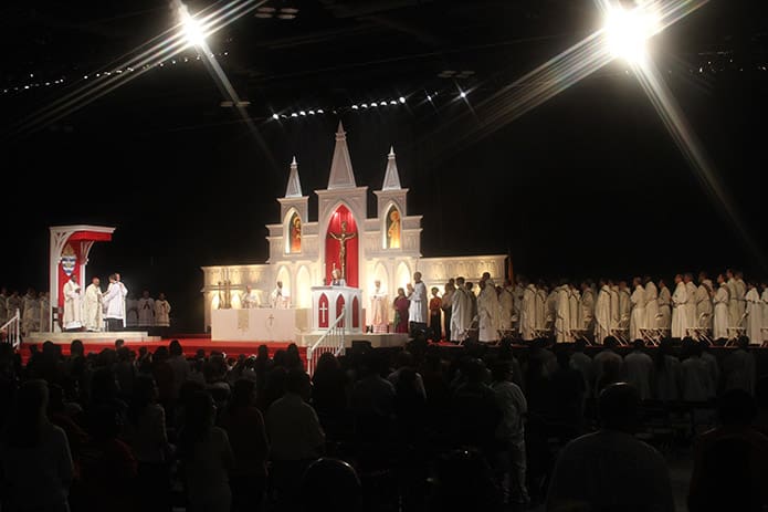 People of different cultures participate in the general intercessory prayers as a representation of the diversity found in the Catholic Church. Photo By Michael Alexander