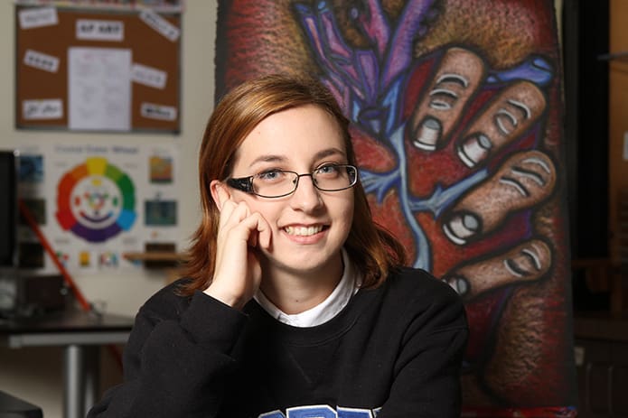 Holy Spirit Preparatory School senior Sarah Martin sits before her pastel drawing entitled âLove Hurts.â She is a member of the National Art Honor Society. Martin will attend the University of North Georgiaâs Dahlonega campus. Photo By Michael Alexander