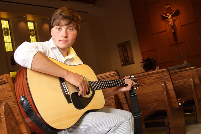 Pinecrest Academy senior Evan Montalbano is a self-taught guitarist. At the age of 14 he encountered personal tragedy when his mother died unexpectedly. With the support of his grandparents, godfather and the school community, Montalbano persevered in his time of grief, and he will attend the University of Georgia, Athens. Photo By Michael Alexander