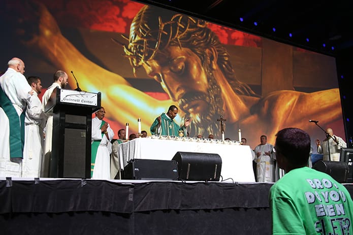 Haitian-born Father Louis Merosne served as the main celebrant and homilist for the July 12 Mass during the Steubenville Atlanta Conference at the Gwinnett Conference Center, Duluth. Photo By Michael Alexander