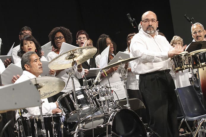 Under the leadership of Nicholas Dragone, director of music, the choir from St. Philip Benizi Church, Jonesboro, provides the music for the closing liturgy. Photo By Michael Alexander