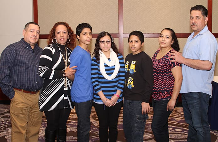 At the conclusion of the Rite of Election (l-r) godparents Javier and Maribel Abarca of Immaculate Heart of Mary Church, Atlanta, pose with catechumen siblings Jorge, Avisail and Isael Sierra and their parents Argelia Nunez and Jorge Sierra. Photo By Michael Alexander