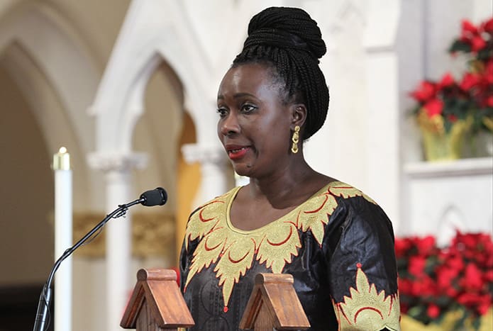 Representing the country of Gambia, Mary Ndure was one of several people from various countries to pray in their native tongue during the Prayers of the Faithful. Photo By Michael Alexander