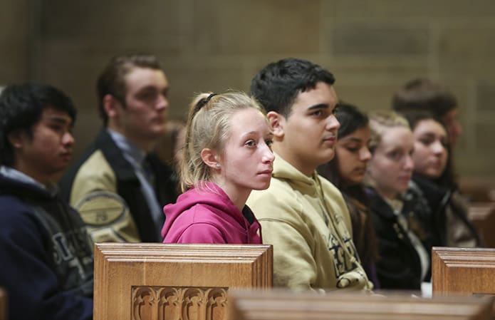 Students from St. Pius X High School, Atlanta, listen to Archbishop Wilton D. Gregory’s homily during the Jan. 22 Mass for the Unborn at the Cathedral of Christ the King, Atlanta. The students on the front pew include (l-r) seniors Lorette Edwards and Javier Rodriguez, sophomore Victoria Gomez and juniors Franchesca Hauck, Katie-Rose Borrello and Michael Young. Photo By Michael Alexander