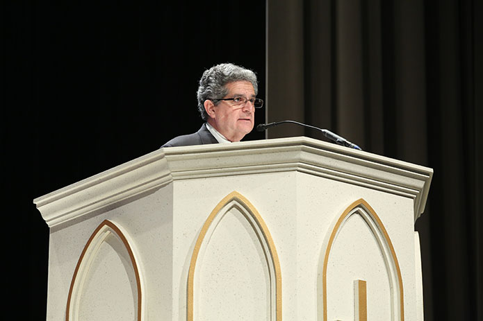 Lius Guzman from the Cathedral of Christ the King, Atlanta, proclaims the second reading in Spanish from Romans 5:12, 17-19. Photo By Michael Alexander