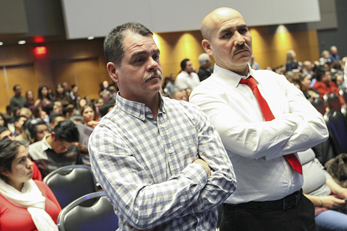 Julian Garduno, right, a catechumen from St. Joseph Church, Athens, stands with his sponsor Rodrigo Mondragon during the presentation of the catechumens. Photo By Michael Alexander