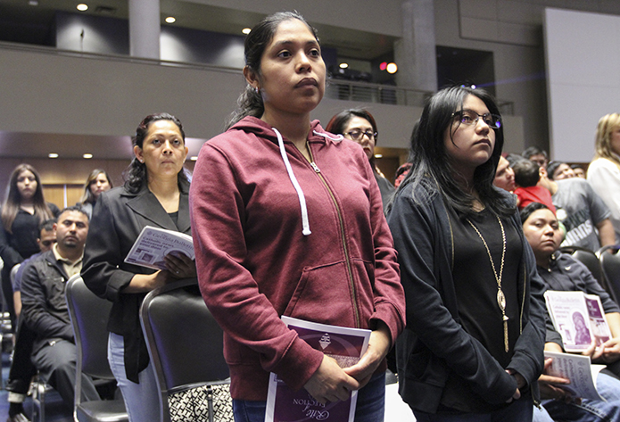 Sixteen-year-old Adriana Teodoro of the Cathedral of Christ the King, Atlanta, right, stands with her sponsor Florelis Carrillo during the presentation of the candidates. Photo By Michael Alexander