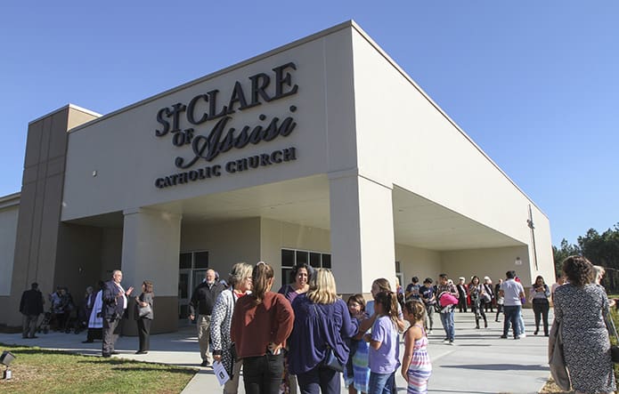 Congregants exit St. Clare of Assisi Church, Acworth, following the Oct. 28 dedication Mass. Photo By Michael Alexander