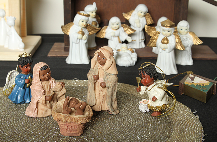 In the foreground is an African crèche and in the background is a Mexican Angel crèche. Notice that all the pieces have wings. Photo By Michael Alexander