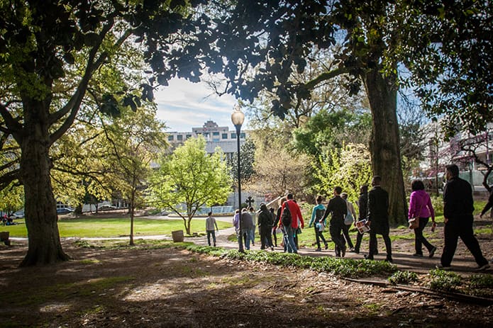 Pilgrims approach Hurt Park in downtown Atlanta during the 38th annual Good Friday Pilgrimage, a two-mile journey with opening and closing prayers and reflections for the 14 Stations of the Cross. Photo By Thomas Spink