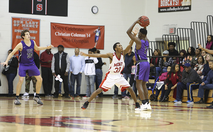 Our Lady of Mercy senior Robert Wheeler and his teammates turned up their defense as the team mounted its final attempt to erase a three-point deficit in the game's closing minutes. Trinity Christian would go on to defeat Mercy 48-41. Photo By Michael Alexander