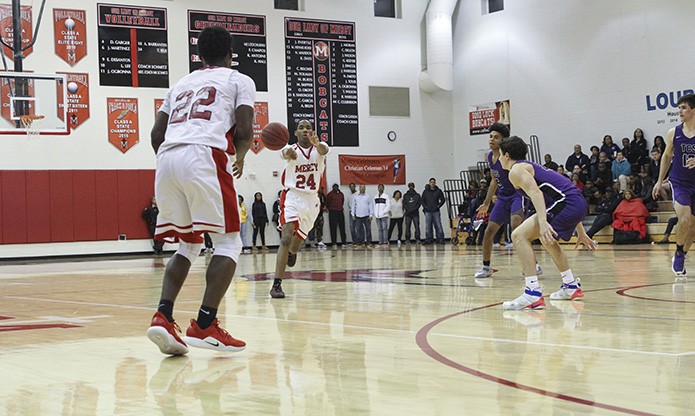 Our Lady of Mercy High School junior Anthony Ogbonna (#24) passes the ball to his teammate on the wing, Jais Toles (#22). Photo By Michael Alexander