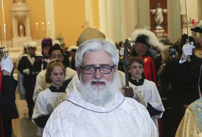 Deacon Robb Ciezki of the Diocese of Buffalo leaves Mary Our Queen Church with the clergy during the recessional hymn, “All Creatures of Our God and King.” Photo By Deacon Ken Melvin