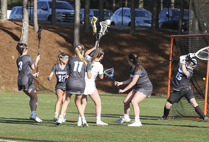 Blessed Trinity midfielder Kelly Scott, fourth from left, is the team's second leading scorer behind Kaley Attaway. Scott finished the match with six goals. Photo By Michael Alexander