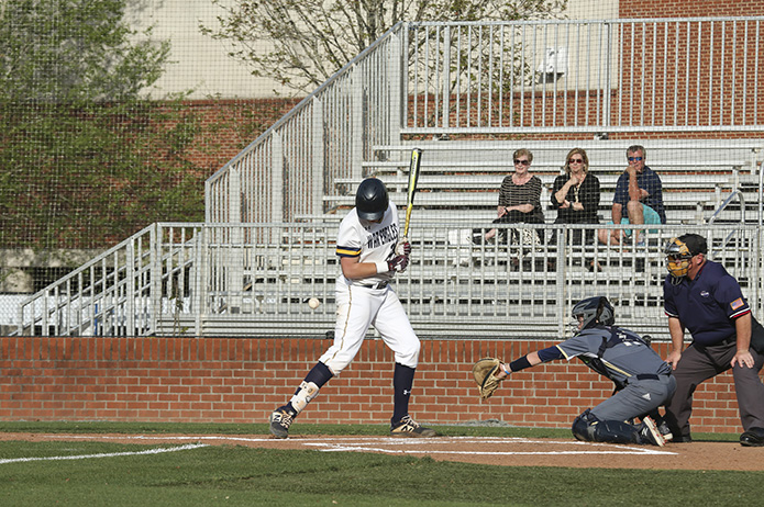 Marist School first baseman Liam Sullivan is hit by a pitch in the second inning during the April 11 game against St. Pius X High School. Photo By Michael Alexander