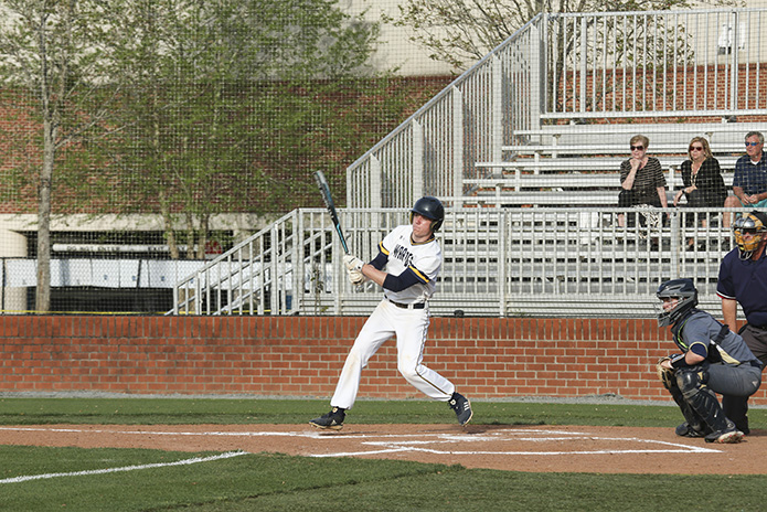 Marist School left fielder Patrick Comerford doubles and bats in a run during the third inning of the game. As a team, Marist scored a total of four runs in the third inning. Photo By Michael Alexander