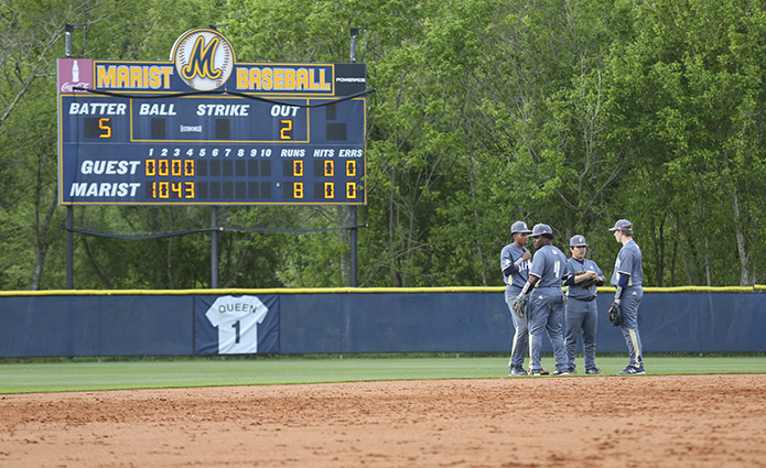 During the fourth inning, (l-r) St. Pius X High School shortstop Chandler Simpson, third baseman DeMarcus Mitchell, second baseman Will Briones and first baseman Nick Kosek have a conference between the infield and outfield during the team's fifth and final pitching change. Photo By Michael Alexander