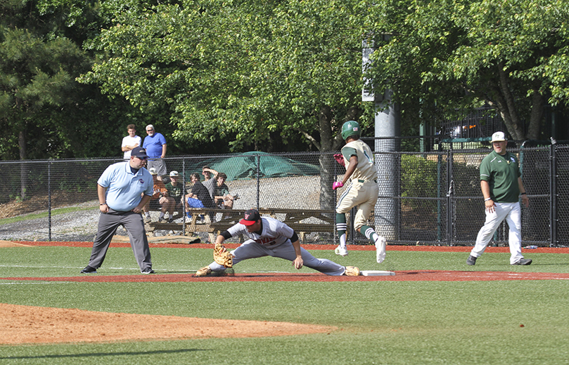 During the third inning of game one, Blessed Trinity short stop C.J. Abrams (#1) safely beats the throw to an outstretched Woodward Academy first baseman. In the third and decisive game, Abrams help lead the team to a 2-1 victory. He scored both runs after he doubled in the first inning and singled in the third inning. Photo By Michael Alexander