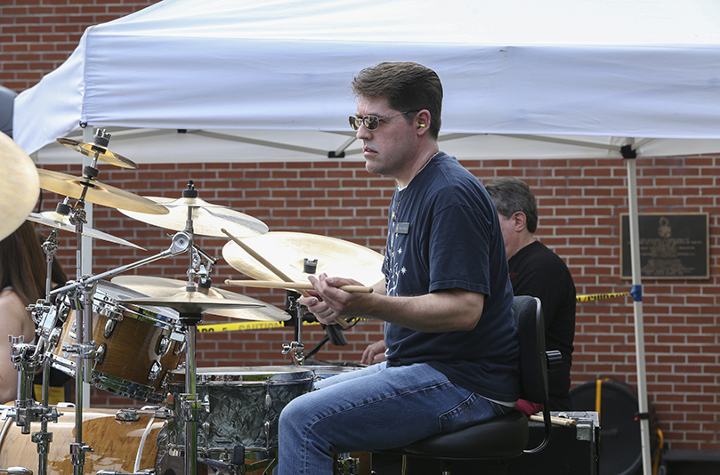 Spencer Brown, a new English teacher who came to St. Pius X in January, fit right in as the latest addition to the Teacher Jam band. Photo By Michael Alexander