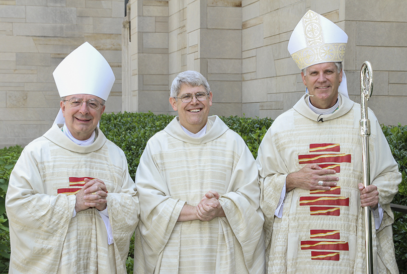 Bishop Joel M. Konzen, SM, left, and Bishop Bernard E. Shlesinger III, right, pose for a post-ordination photo with the Archdiocese of Atlantaâs newest priest, Father Mark White, center. Photo By Michael Alexander