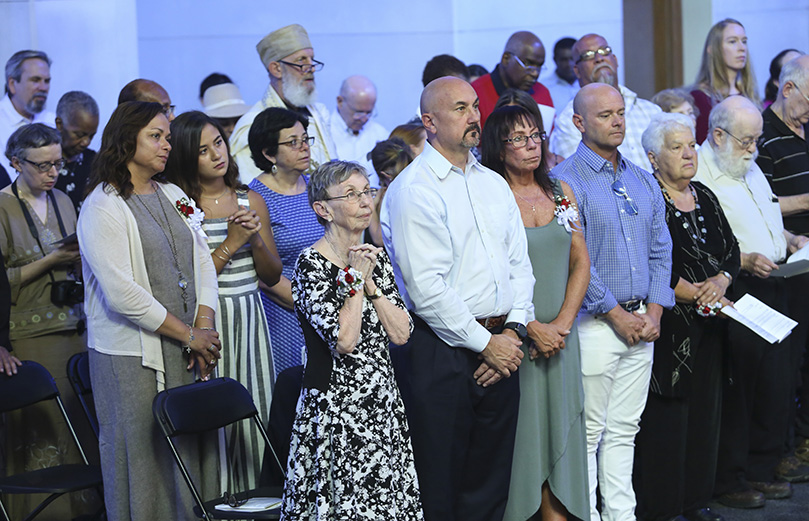 (Front row, l-r) Joyce Spera from Greensboro, North Carolina, the mother of Father Peter Damian, OCSO, his brother Don from Johns Creek, his sister Mary Eddy from Akron, Ohio, and his brother Dave from Charlotte, North Carolina, join the family of Father Cassian Russell, OCSO, including his sister-in-law Lela Russell from Carmel, Indiana, and her husband and his brother Doug, for the two monks’ priesthood ordination. Father Russsell’s brother, Rick, from Dallas, Texas, was also in attendance. Photo By Michael Alexander