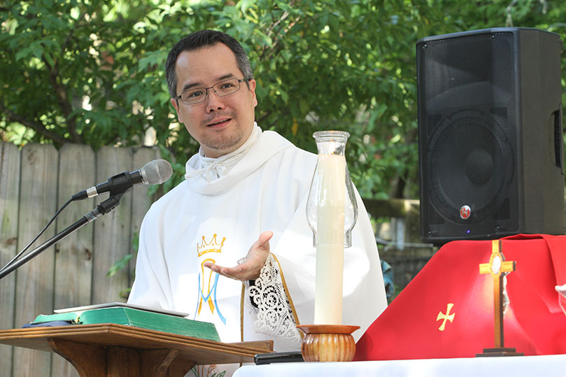 Father Brian Baker gives the homily during the June 29 Mass at the Gift of Grace House. The Mass fell on the fifth anniversary of his first Mass as a newly ordained priest. Father Baker is the current confessor for Atlanta’s Missionaries of Charity. Photo By Michael Alexander  