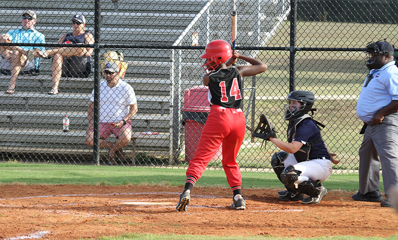 Khalani Roundtree, the team's catcher, stands in the batter's box waiting for the pitch. She had a base hit in the second inning and a double in the third inning. Photo By Michael Alexander