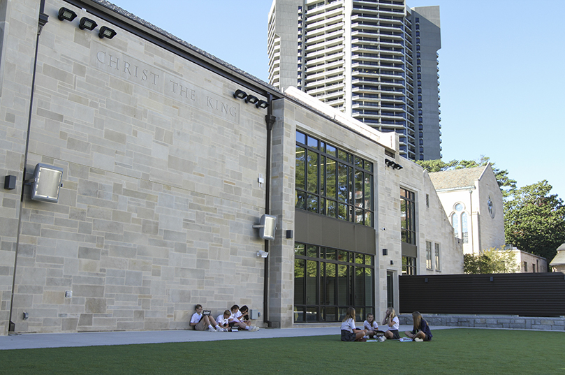 Seventh grade students study outside on the Hyland Center's greens space, known as the East Wesley Lawn, on a balmy October day. Photo By Michael Alexander