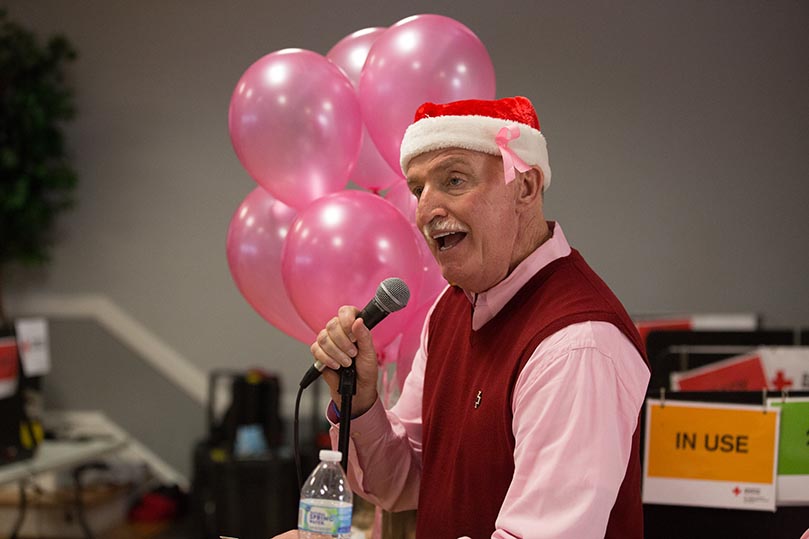 Mark Kelly announces another raffle prize for a lucky blood donor. Photo By Rob Buechner